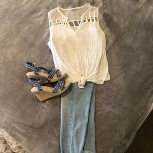 Sleeveless cream color blouse with tie in front